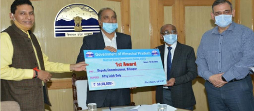Hon'ble CM giving the Award to DC Bilaspur