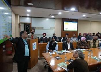 NIC official conducting a detailed presentation on the eDAR system, demonstrating its features for real-time accident reporting and streamlined claim