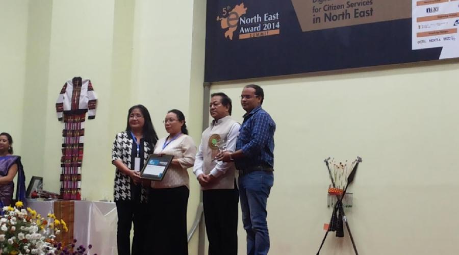 Lal Thanzara, Minister for IT conferring the Recognition Certificate and Trophy to Lallianmawii Hnamte C. Lalmuanawmi and Sandip Pramanik