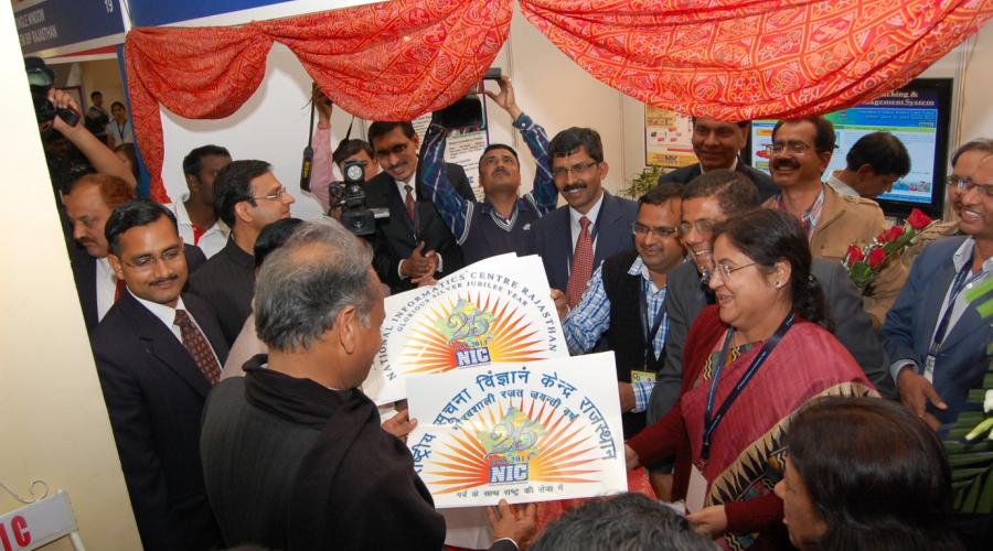 Honourable MoS Sh. Narayansamy and CM Rajasthan Sh. Ashok Gehlot releasing the NIC RAjasthan Silver Jubilee logo at the NIC stall at the NCEG 2013