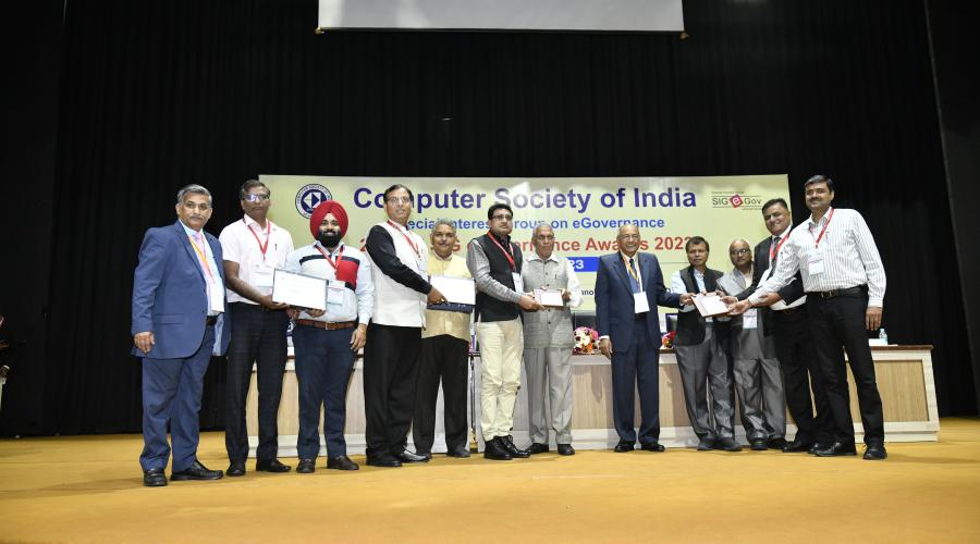 Sh. Deepak Bansal,SIO,NIC,Haryana, Sh. MP Kulshreshtha, Sr. Director IT,Sh. Pardeep Kumar Kaushal, Sr. Director IT and Sh. Amit Bansal receiving award