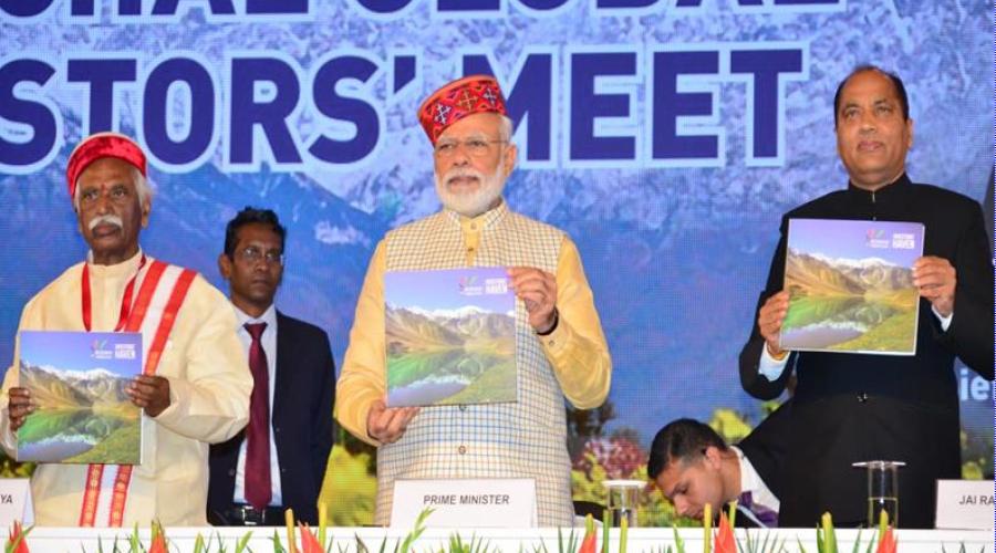 Sh. Narendra Modi, Honourable PM of India releasing the Coffee Table Book on Global Investor Meet, with Honourable Governor HP and Honourable CM HP